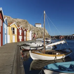 Boats and colourful boathouses in the harbour of Smoegen