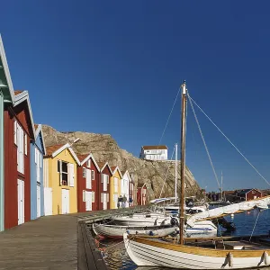 Boats and colourful boathouses in the harbour of Smoegen