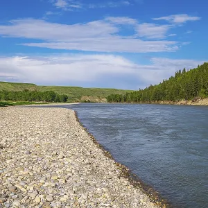 The Bow River flows past the cobble river bank at McKinnon Flats southeast of Calgary The Bow River flows past the cobble river bank at McKinnon Flats southeast of Calgary