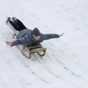 Boy, 12, tobogganing