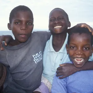 Three boys posing for camera, Chitimba Three boys posing for camera, Chitimba
