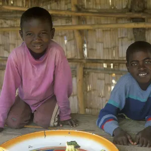 Two boys work at a market in Kande on Lake Malawi Two boys work at a market in Kande on Lake Malawi