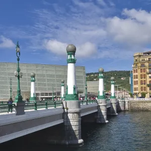 Bridge construction over a river with adjacent historic buildings and blue sky Bridge construction over a river with adjacent historic buildings and blue sky