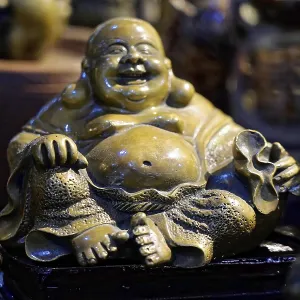 Bronze sculpture of a smiling seated Buddha Bronze sculpture of a smiling seated Buddha