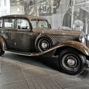 Brown classic car in an exhibition with historic ambiance Brown classic car in an exhibition with historic ambiance