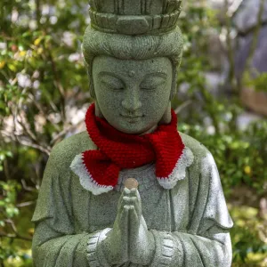 Buddha statue with colorful caps Buddha statue with colorful caps