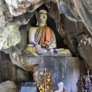 Buddha statue sitting in a cave