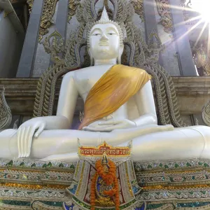Buddha statue with tunic, Bhumispara mudra Buddha statue with tunic, Bhumispara mudra