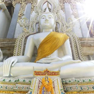 Buddha statue with tunic, Bhumispara mudra Buddha statue with tunic, Bhumispara mudra