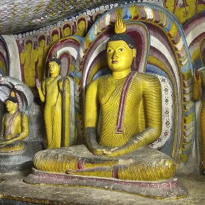 Buddha statues and murals in one of the cave temples of the Golden Temple Buddha statues and murals in one of the cave temples of the Golden Temple