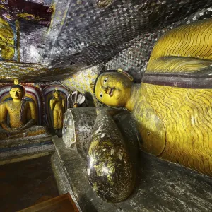 Buddha statues and murals in one of the cave temples of the Golden Temple Buddha statues and murals in one of the cave temples of the Golden Temple