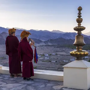 Buddhist monks blowing conch shells at Thikse Monastery (Thiksay Gompa)