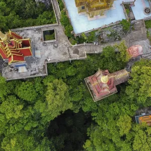 A buddhist temple on a mountain in Cambodia seen from above