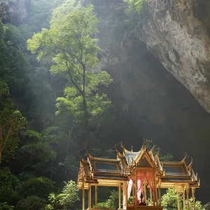 Buddhist temple in picturesque cave with sunlight Buddhist temple in picturesque cave with sunlight