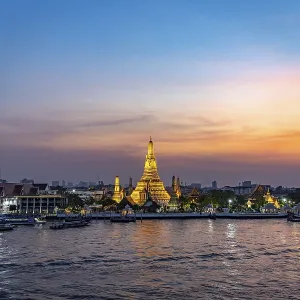 The Buddhist temple Wat Arun or Temple of Dawn and the Chao-Phraya River at dusk The Buddhist temple Wat Arun or Temple of Dawn and the Chao-Phraya River at dusk