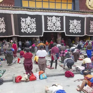Buddhists pray in front of Jokhang Temple in Lhasa Buddhists pray in front of Jokhang Temple in Lhasa