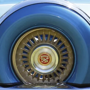 Cadillac emblem in the rim of the spare tyre at the rear of a 1956 Cadillac Eldorado classic car Cadillac emblem in the rim of the spare tyre at the rear of a 1956 Cadillac Eldorado classic car