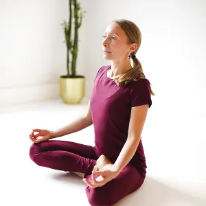 Calm female in sportswear practicing yoga in Firefly pose while balancing and looking away Calm female in sportswear practicing yoga in Firefly pose while balancing and looking away