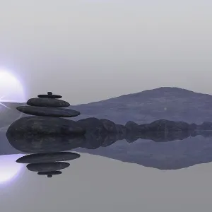 Calm lake beach with stacked stones Calm lake beach with stacked stones