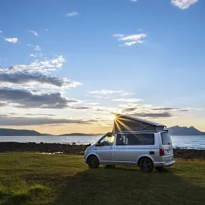 Camper standing by fjord, VW California