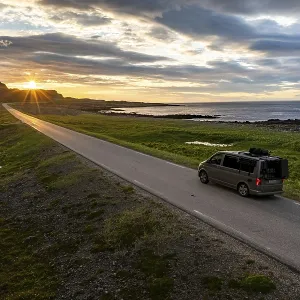 Camper van travelling along the road to Berlevag Camper van travelling along the road to Berlevag