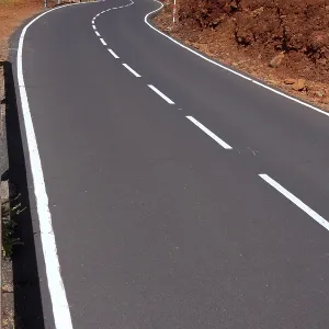 Canary Islands winding road curves in red mountain