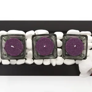 Candles with white stones and orchid blossom zen like spa background Candles with white stones and orchid blossom zen like spa background