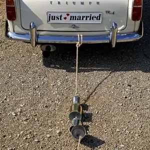 Car with Just married trail of cans Car with Just married trail of cans