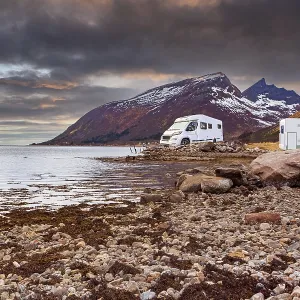 A caravan or mobile home in front of fjord in Norway A caravan or mobile home in front of fjord in Norway