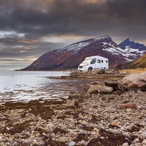 A Caravan or mobile home in front of fjord in Norway