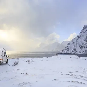 Caravan or mobile home in front of wintry landscape