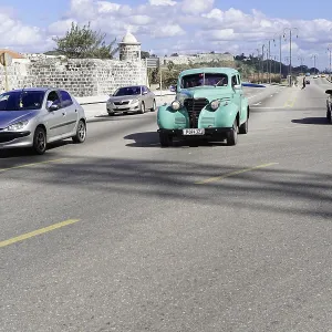 Several cars, including a vintage car Several cars, including a vintage car