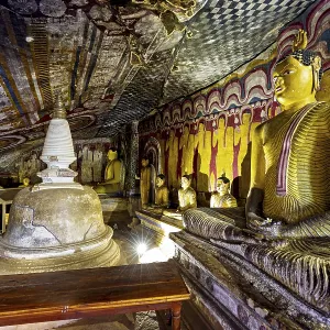 Cave with several Buddha statues and wall paintings Cave with several Buddha statues and wall paintings
