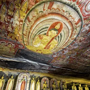 Ceiling painting in a cave with detailed Buddhist representations in strong colors Ceiling painting in a cave with detailed Buddhist representations in strong colors