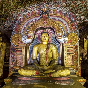 Central Buddha in a richly decorated frame within a cave decorated with ornaments Central Buddha in a richly decorated frame within a cave decorated with ornaments