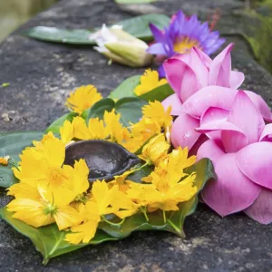 Ceremonial flowers and oil burning arrangement