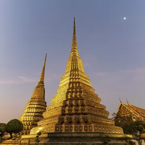 Chedis in the Buddhist temple Wat Pho at dusk