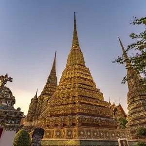 Chedis in the Buddhist temple Wat Pho at dusk