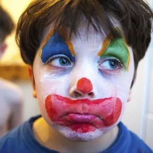 Child with a clown makeup, Germany
