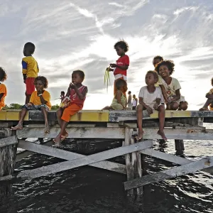 Children on a jetty, Arborek, Raja Ampat