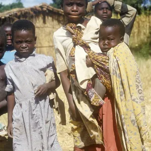 Children posing for the camera on the side of the road Children posing for the camera on the side of the road