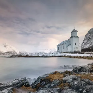 Church of Gimsoy in front of snowy mountains Church of Gimsoy in front of snowy mountains