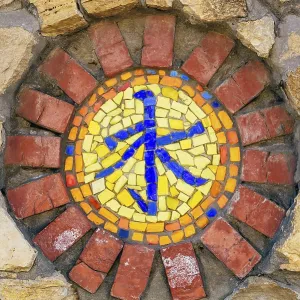 Circular mosaic religious symbol of confucianism on stone wall Circular mosaic religious symbol of confucianism on stone wall
