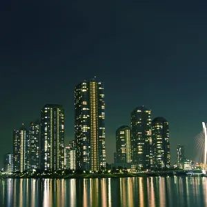 Cityscape of night Tokyo, modern district buildings at Tsukishima district