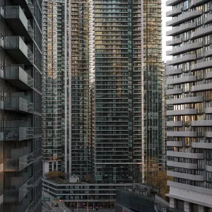 Cityscape with tall modern skyscrapers in the warm light of sunset in Toronto Cityscape with tall modern skyscrapers in the warm light of sunset in Toronto
