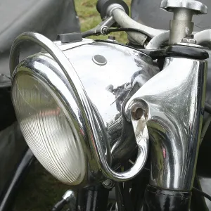 Classic car headlight of a motorbike with sidecar