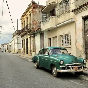 Classic car in the historic district of Camaguey Classic car in the historic district of Camaguey