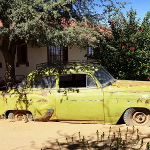 Classic Car Wreck in the Garden of Canyon Roadhouse at Seeheim Print, Namibia Classic Car Wreck in the Garden of Canyon Roadhouse at Seeheim Print, Namibia