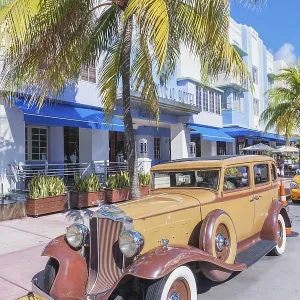 Classic vintage american car parked on Ocean drive Classic vintage american car parked on Ocean drive