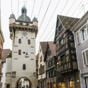 Clock tower and artfully painted half-timbered houses Clock tower and artfully painted half-timbered houses